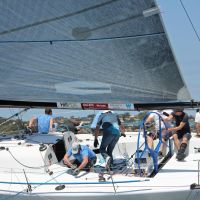 Joe in moon boot helming Good Form credit Jennie Hughes